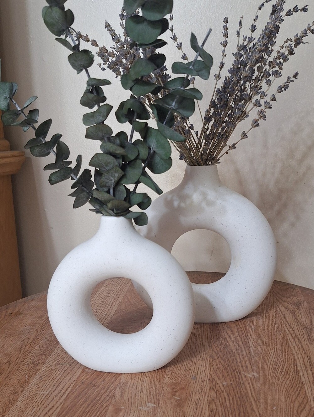 Set of 2 white ceramic speckled donut vases